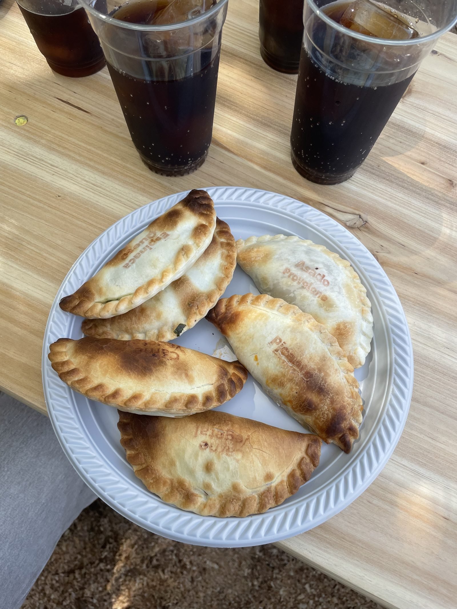 Freshly baked Gauchas Argentine empanadas, with the flavours stamped into the dough